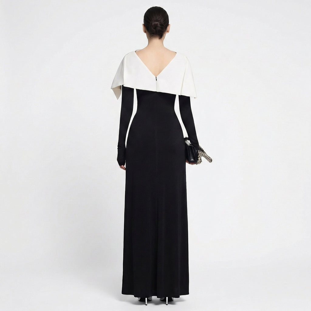 Woman wearing a black and white evening gown on a white background