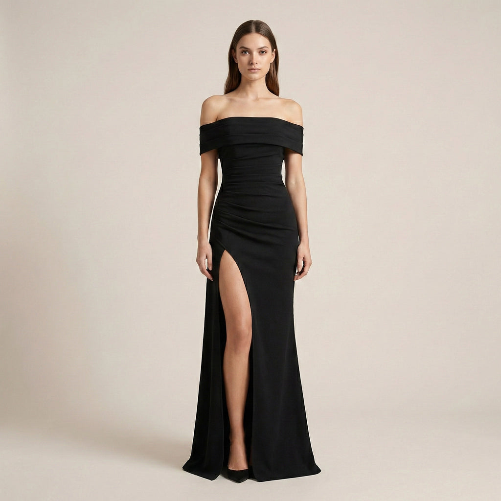 Black off-shoulder gown with a high slit on a beige background