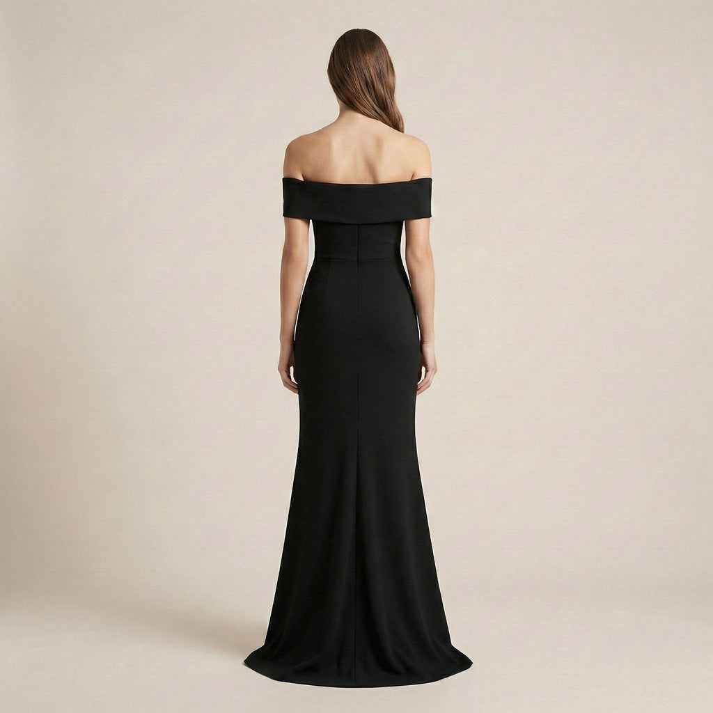 Black off-shoulder gown on a beige background