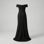 Black off-shoulder evening gown on a light gray background