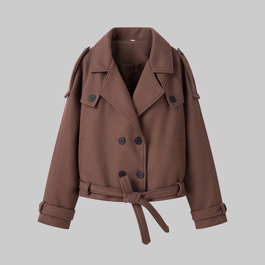 Brown jacket with a belt on a gray background