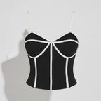 Black and white striped crop top on a light gray background
