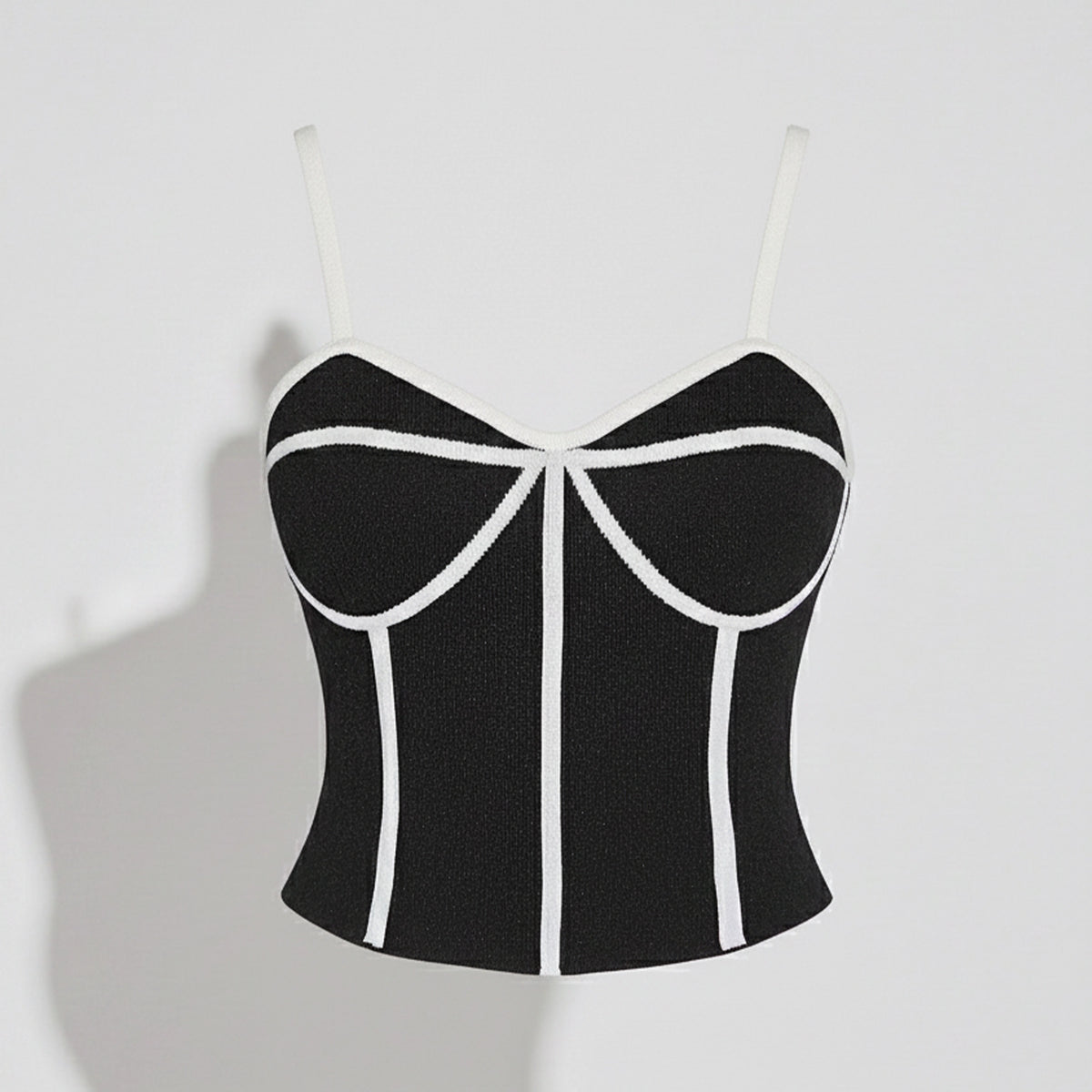 Black and white striped crop top on a light gray background
