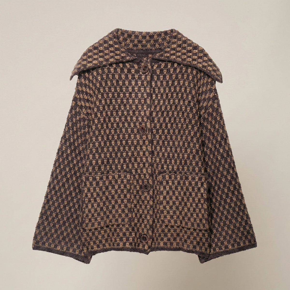 Brown patterned coat on a beige background