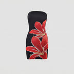 Black strapless dress with red floral design on a light gray background