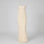 Beige slip dress on a gray background