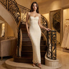 Woman in a white dress standing in a elegant interior setting