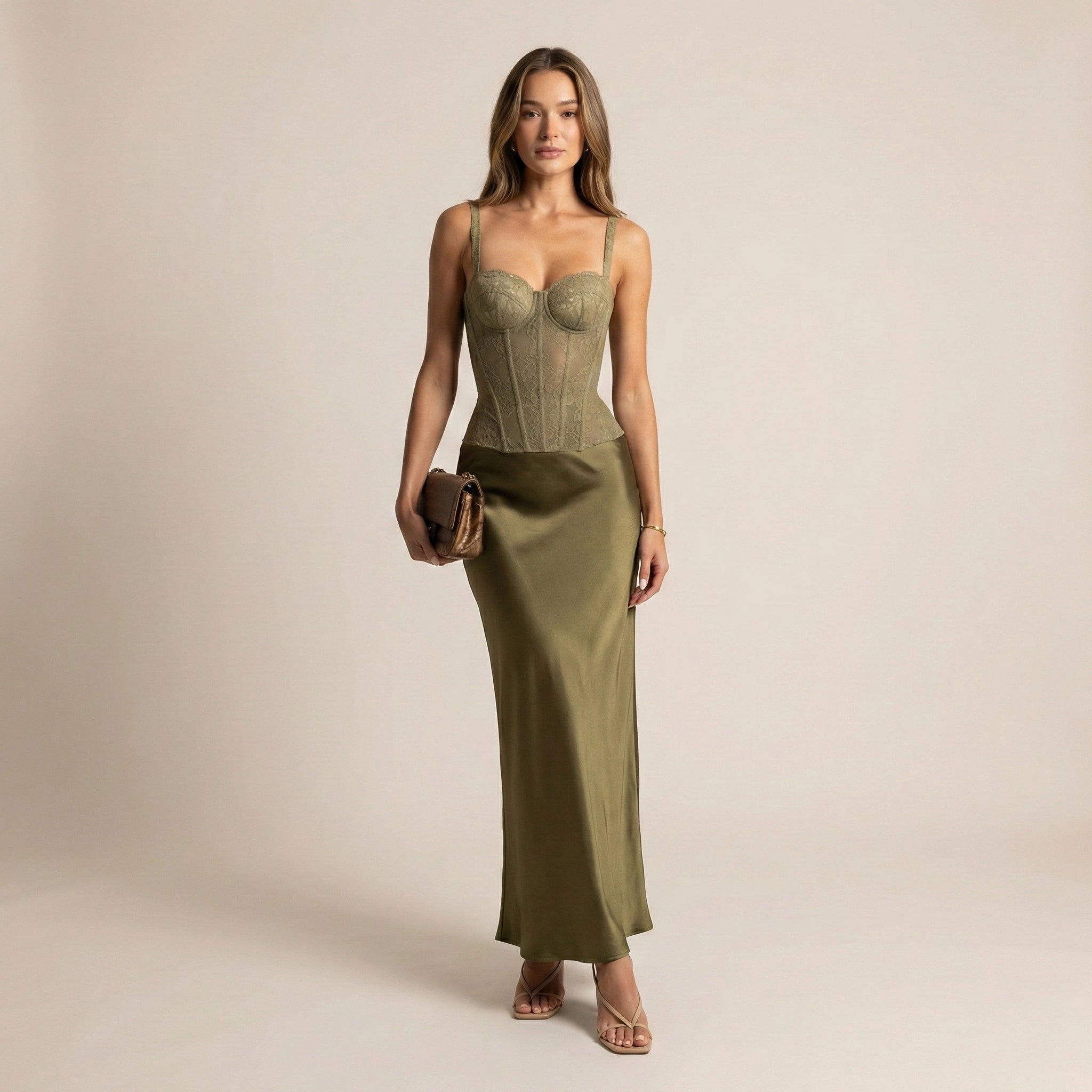 Woman wearing a green dress with a plain background