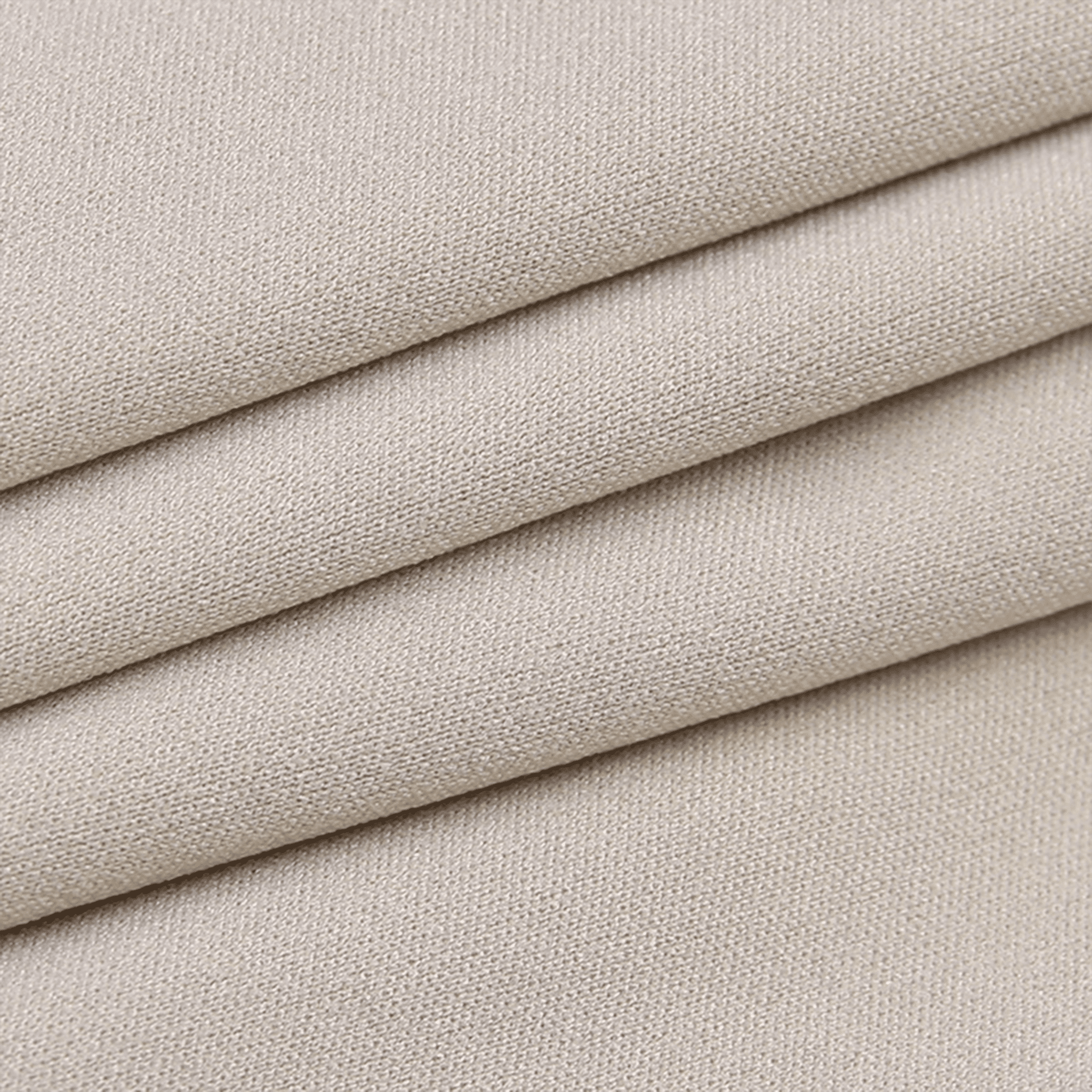 Stack of beige fabric swatches