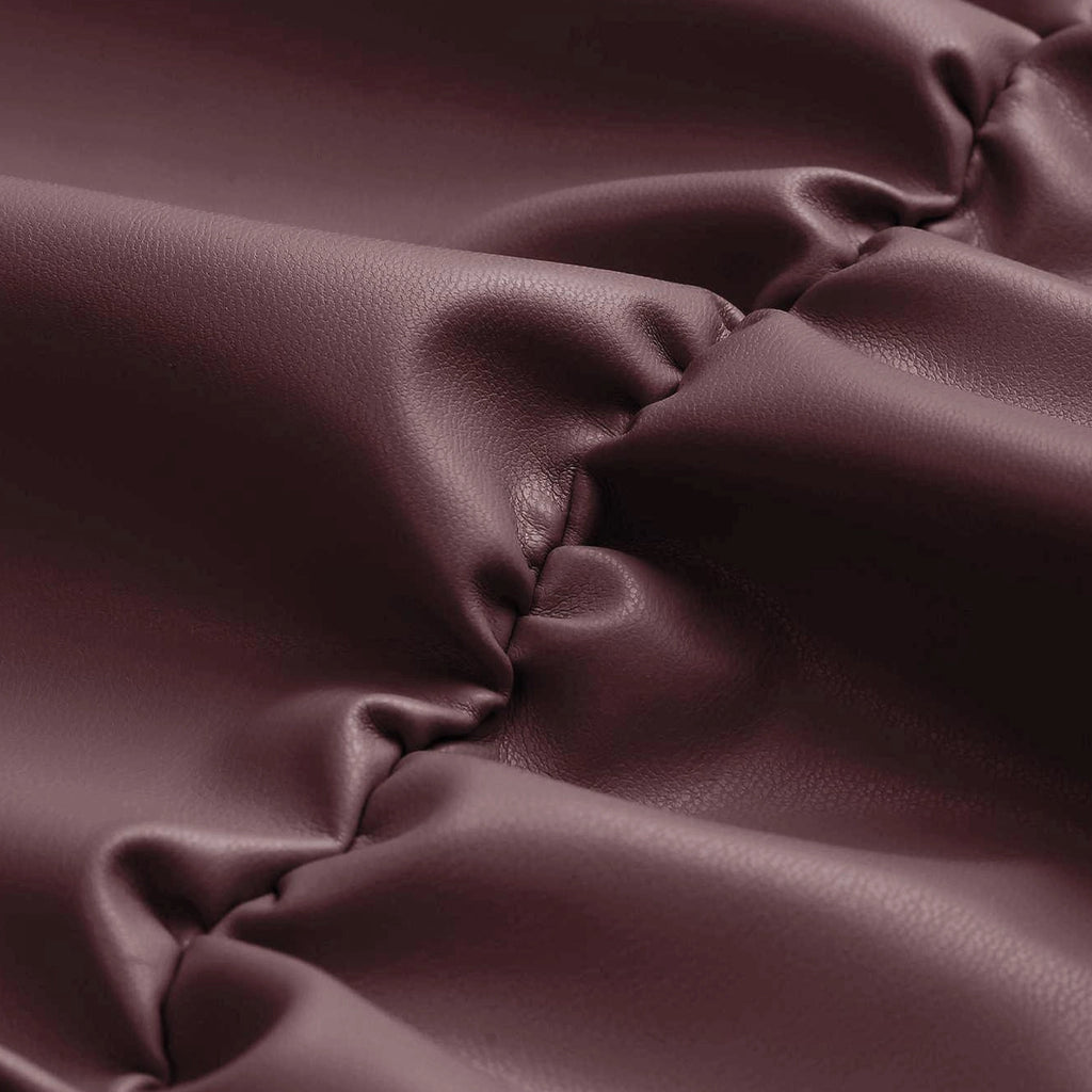 Close-up of maroon fabric with folds