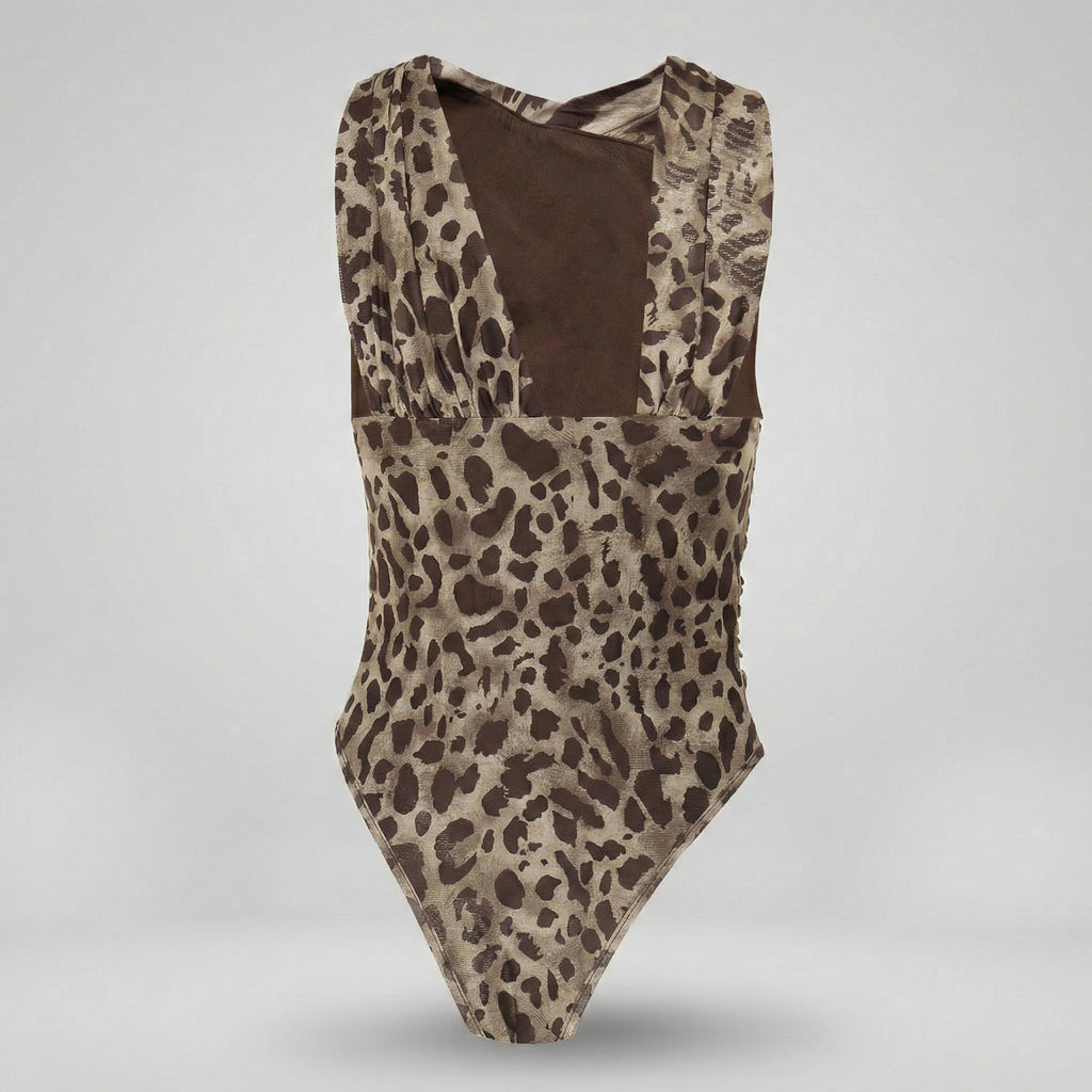Leopard print swimsuit with brown interior on a light gray background