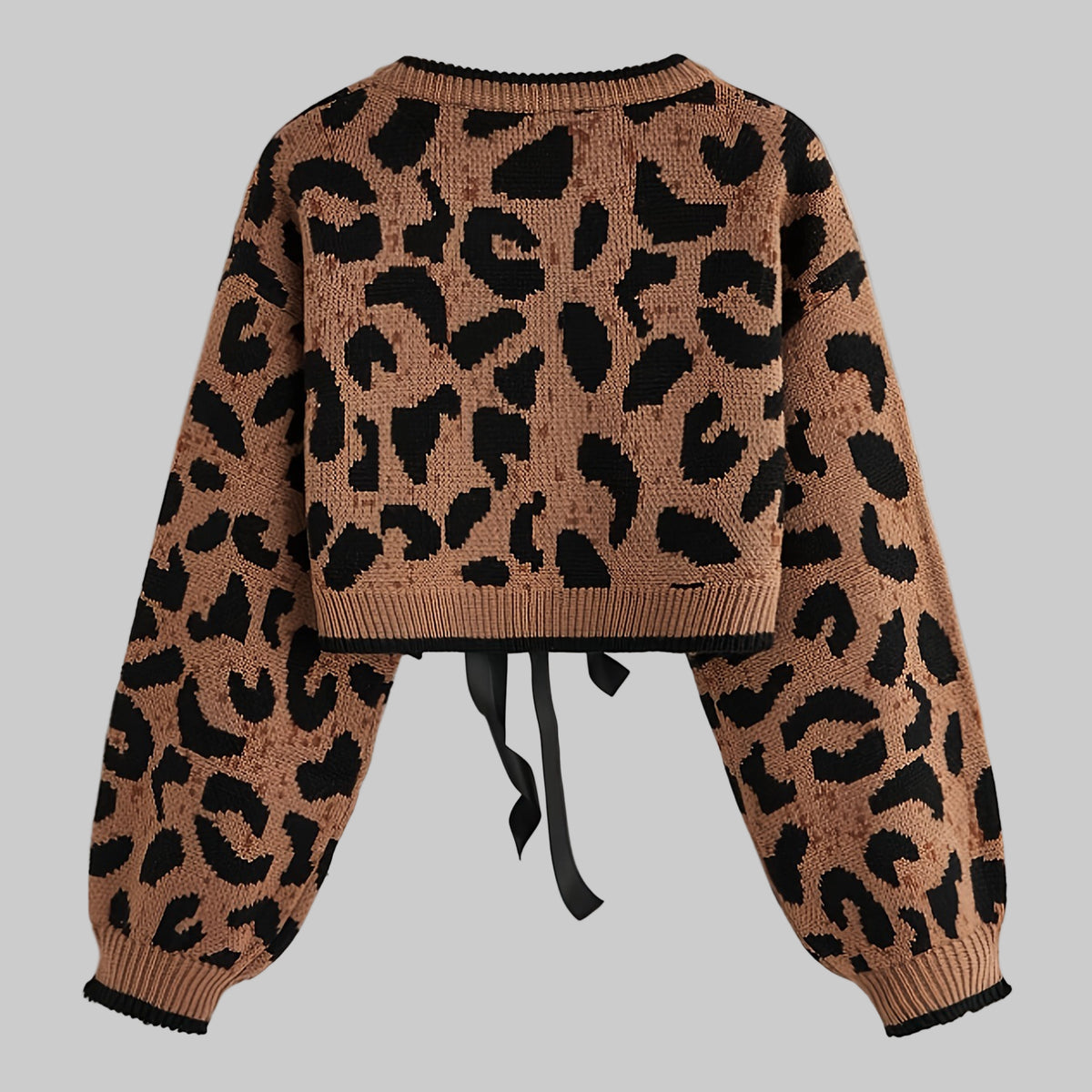 Leopard print sweater with a tie detail on a light gray background