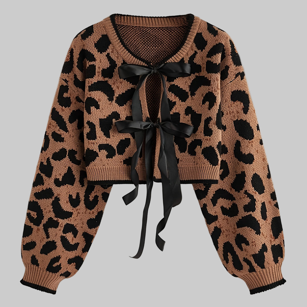 Leopard print cardigan with a black ribbon on a light gray background