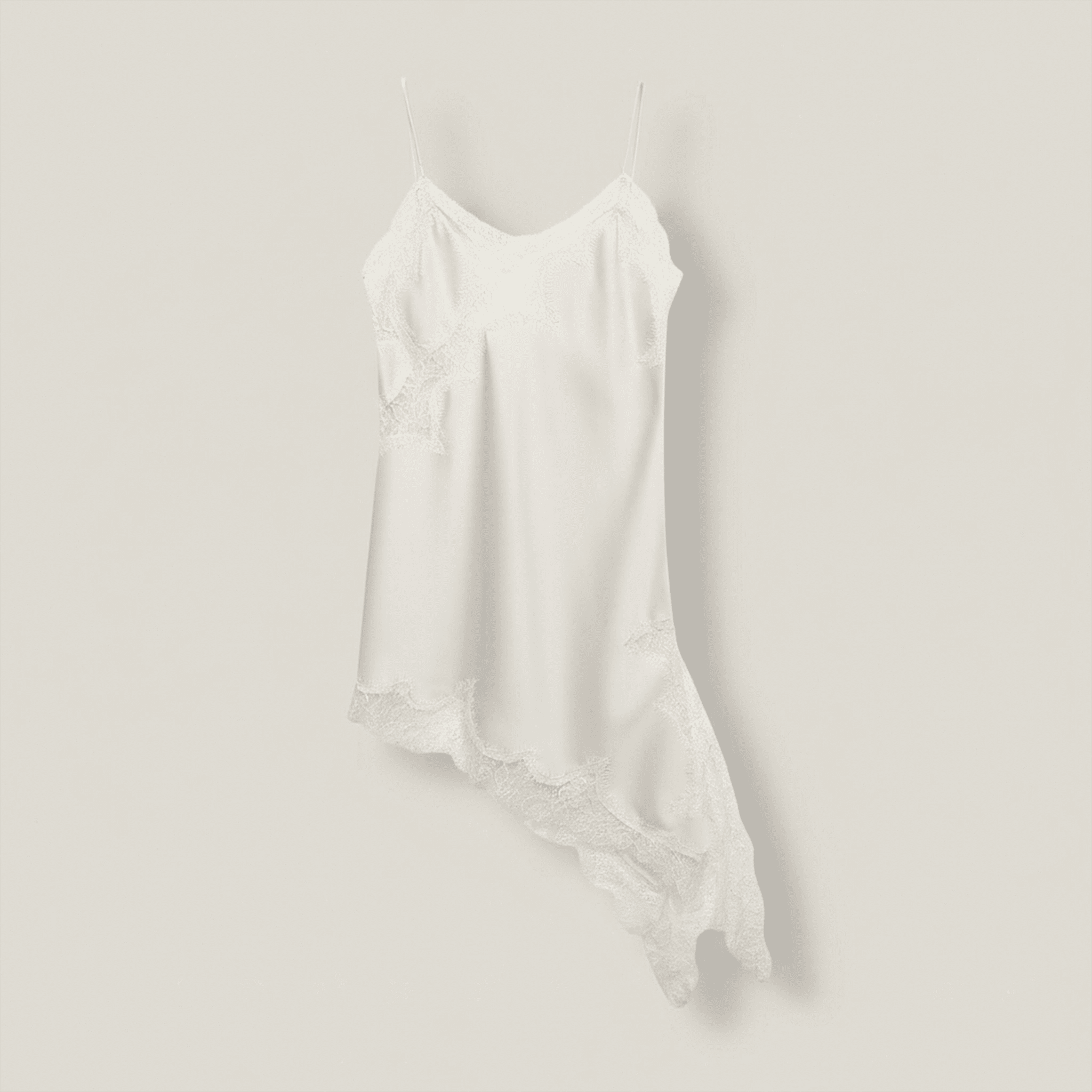 White slip dress on a mannequin against a plain background