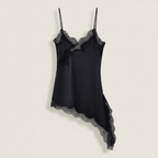 Black satin slip dress with lace trim on a light beige background