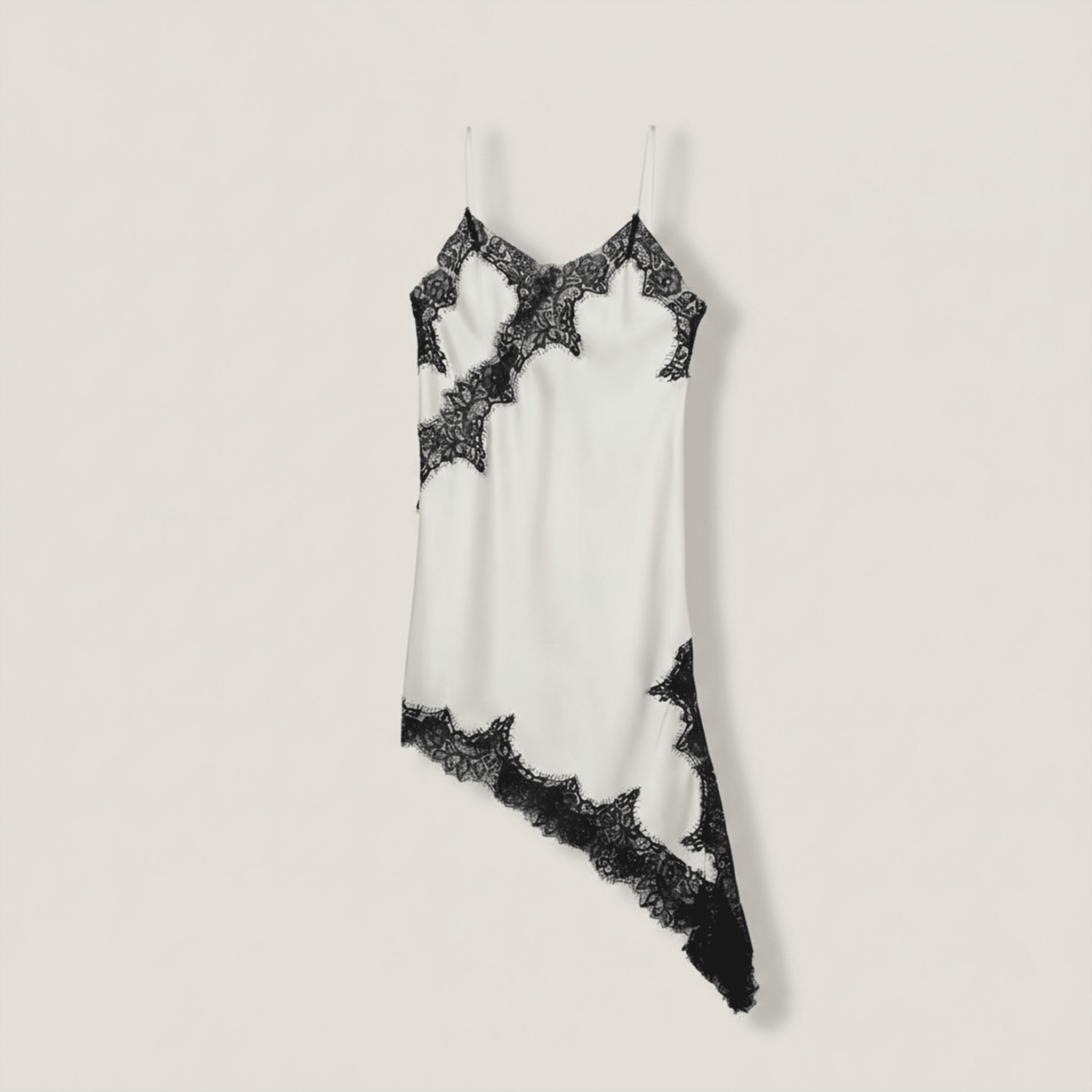 White lace nightgown with black lace trim on a light gray background