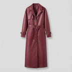 Maroon leather trench coat on a light gray background