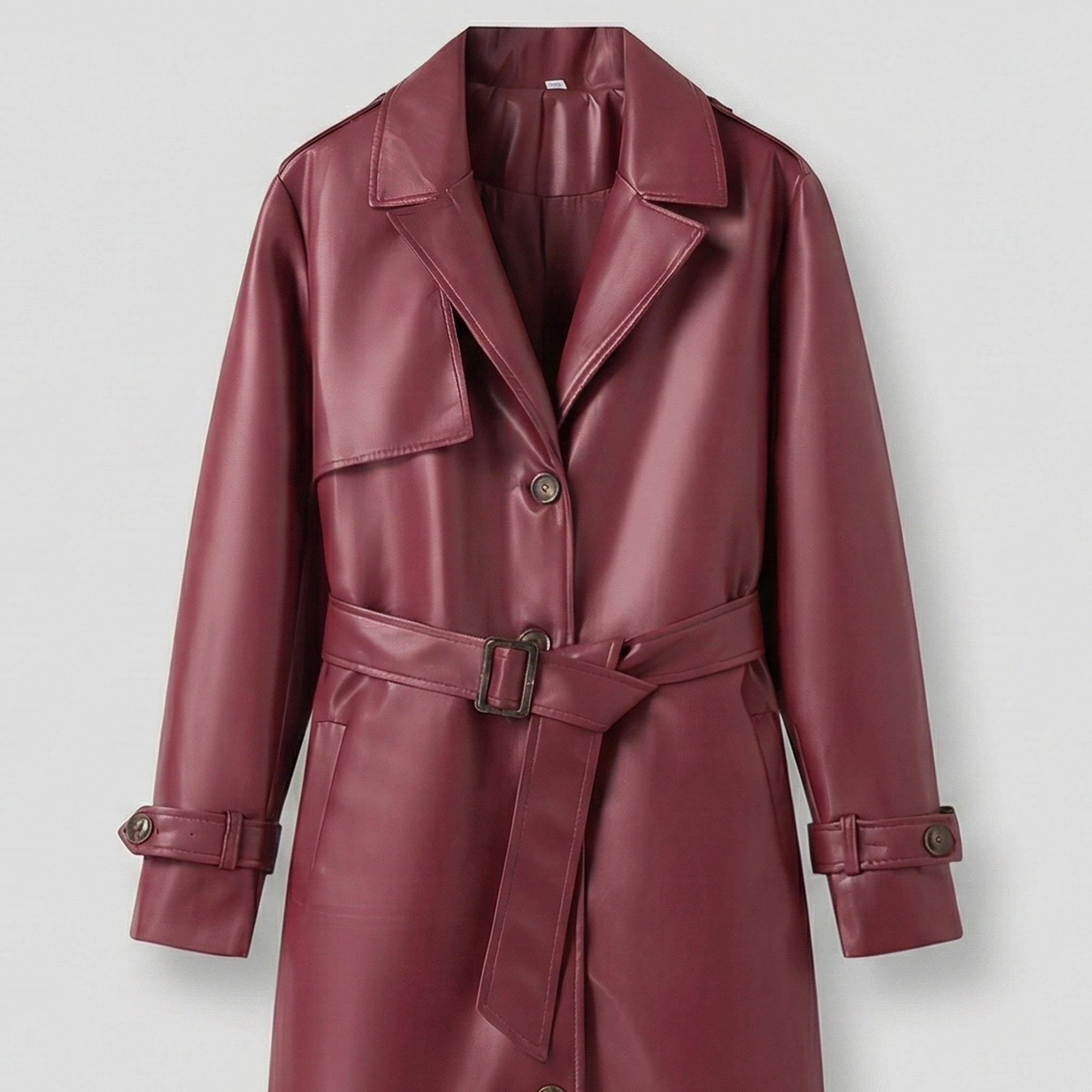 Maroon leather trench coat on a light gray background