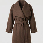 Brown coat with a belt on a light gray background