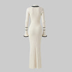 White ribbed dress with black trim on a white background