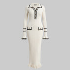 White dress with black accents on a white background