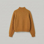 Brown sweater on a light gray background