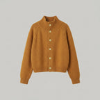 Brown knitted cardigan with buttons on a light gray background