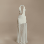 White halter neck dress with sheer overlay on a beige background