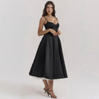 Woman wearing a black dress on a white background