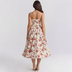 Woman wearing a floral dress on a plain background