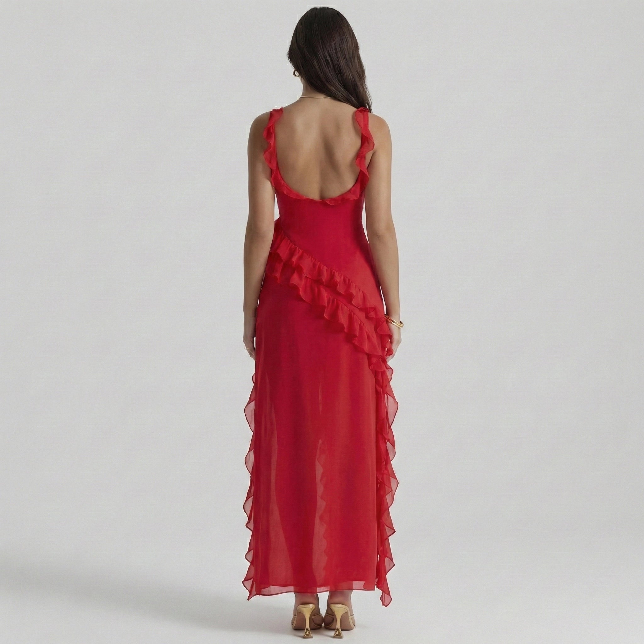 Red evening gown with ruffled details on a white background