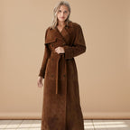 Woman wearing a brown trench coat on a white background