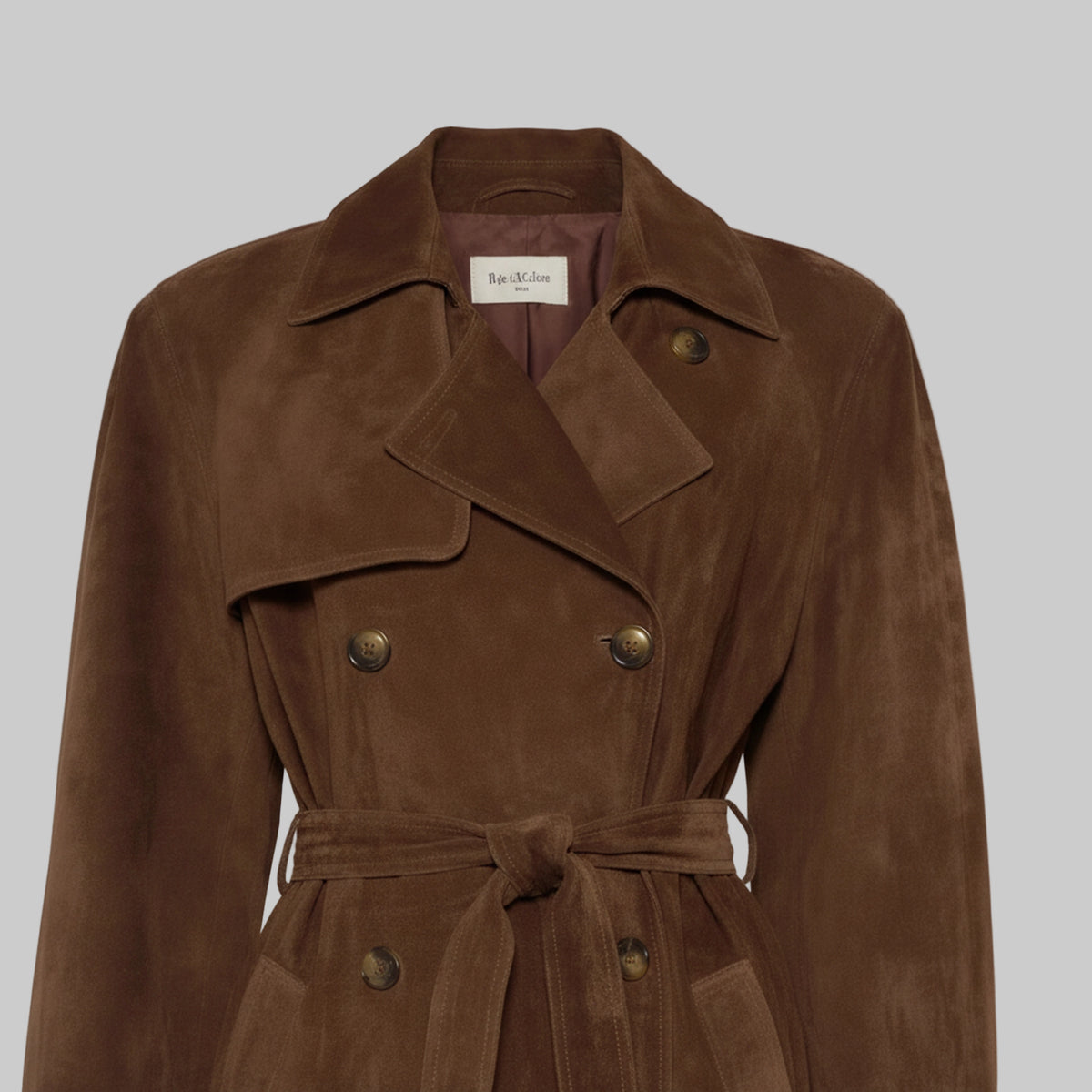 Brown suede trench coat with gold buttons on a light gray background