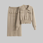 Beige shirt and skirt set on hangers against a gray background