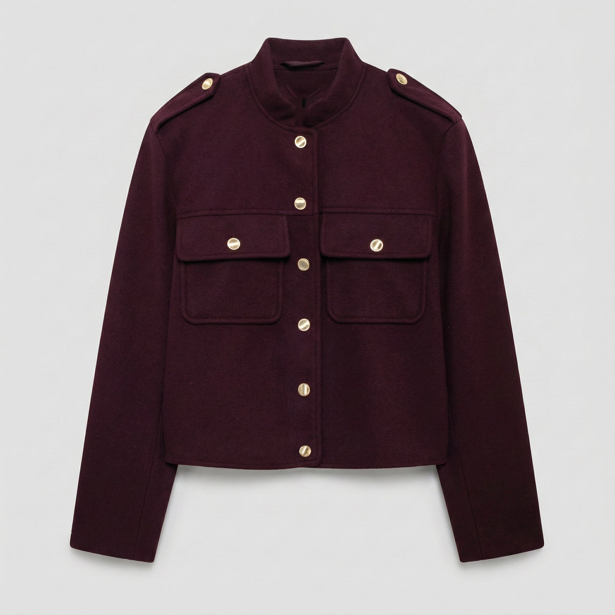Maroon jacket with gold buttons on a light gray background