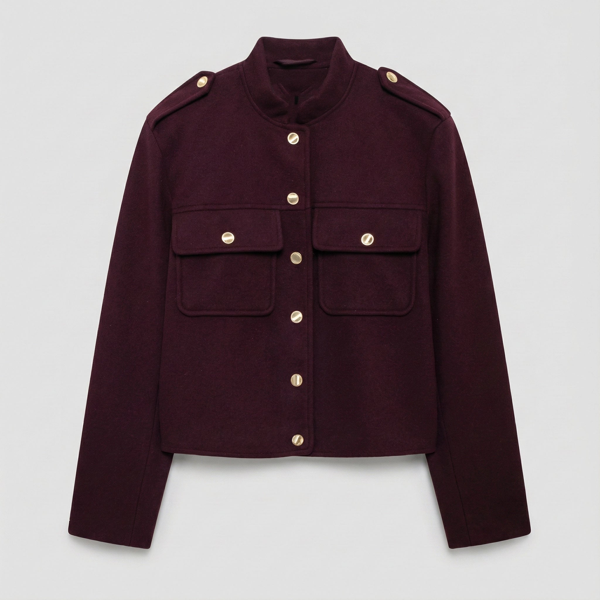 Maroon jacket with gold buttons on a light gray background