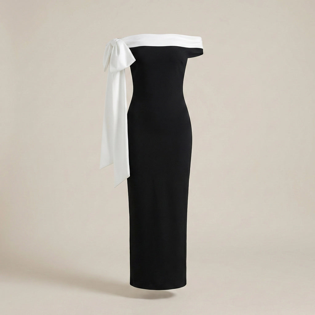 Black off-shoulder dress with white ribbon on a beige background