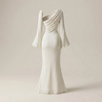 Elegant white evening gown with a draped design on a beige background