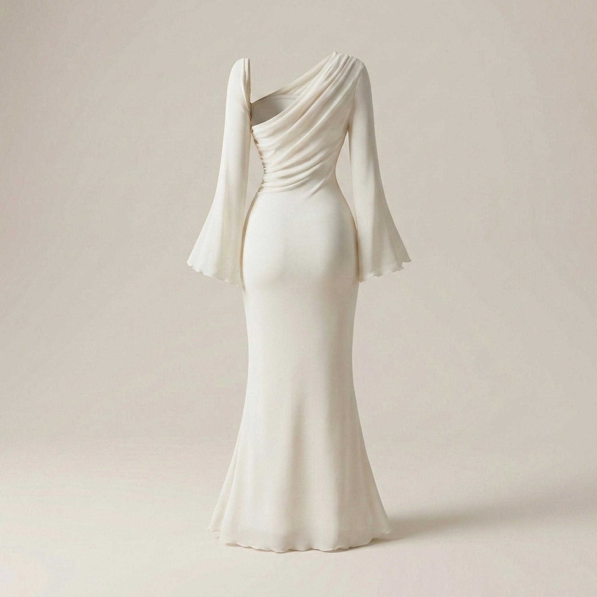 Elegant white evening gown with a draped design on a beige background