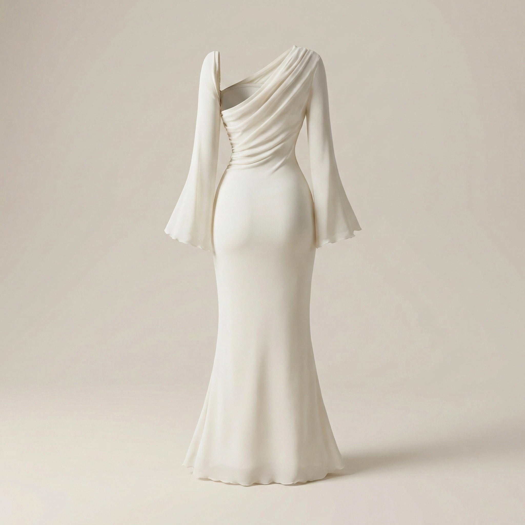 Elegant white evening gown with a draped design on a beige background