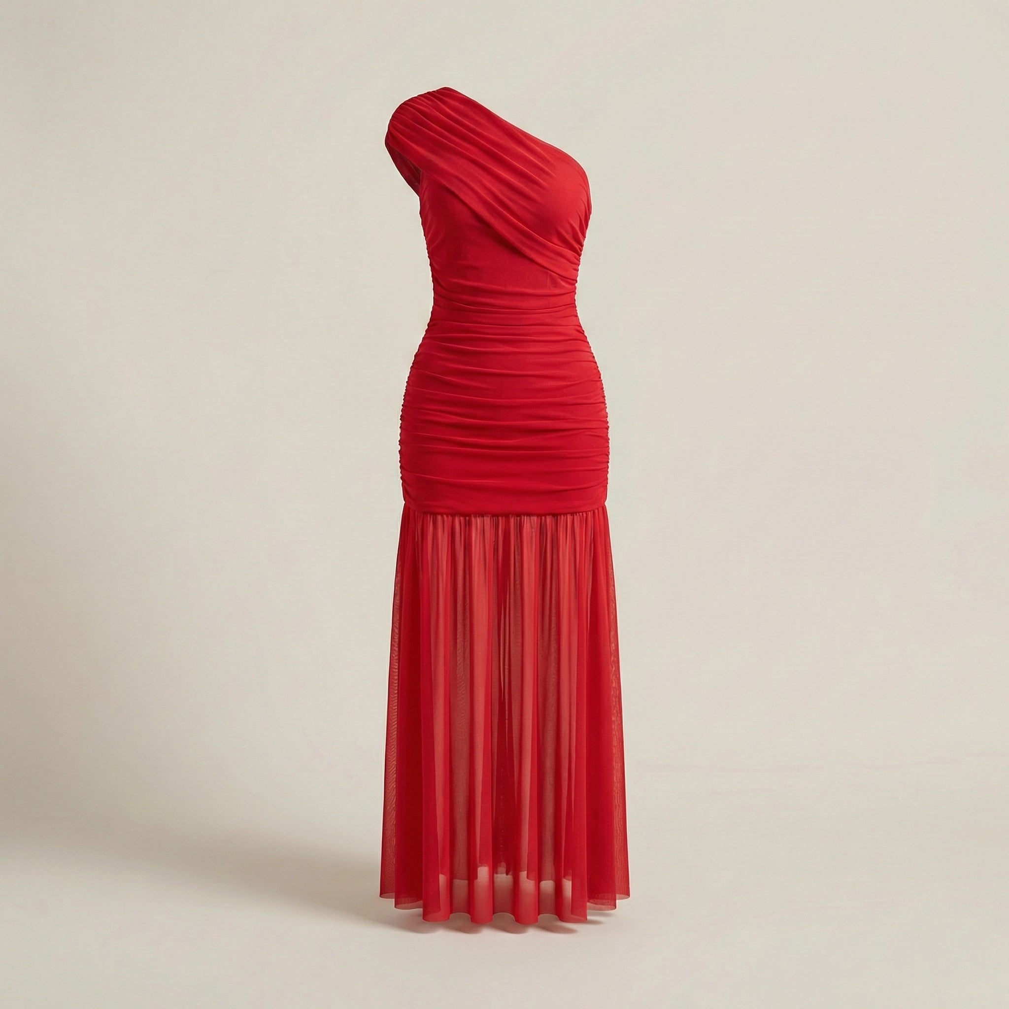 Red one-shoulder dress on a beige background