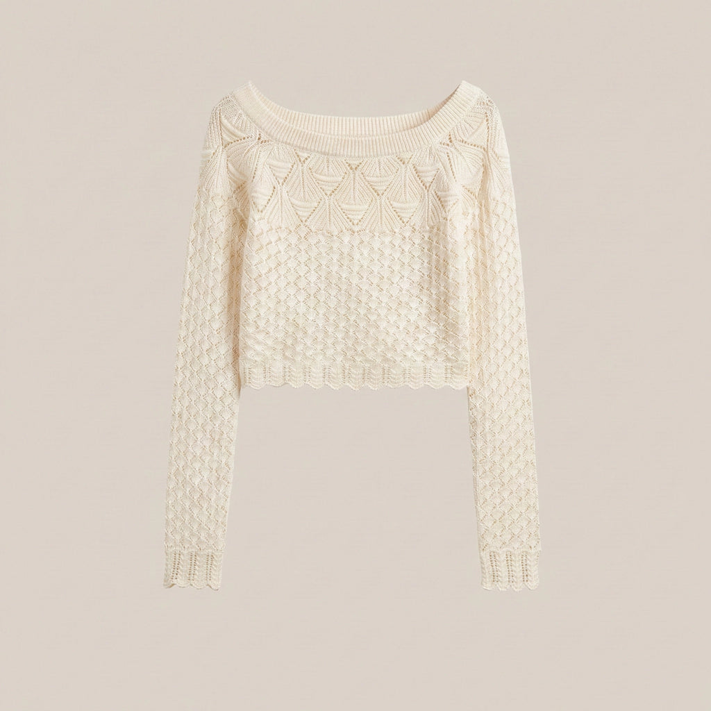 Cream-colored sweater with intricate pattern on a light gray background