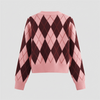 Pink and brown argyle pattern sweater on a light gray background