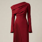 Red one-shoulder dress on a beige background