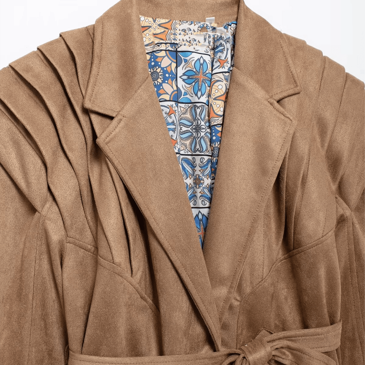 Brown coat with a colorful patterned lining on a white background
