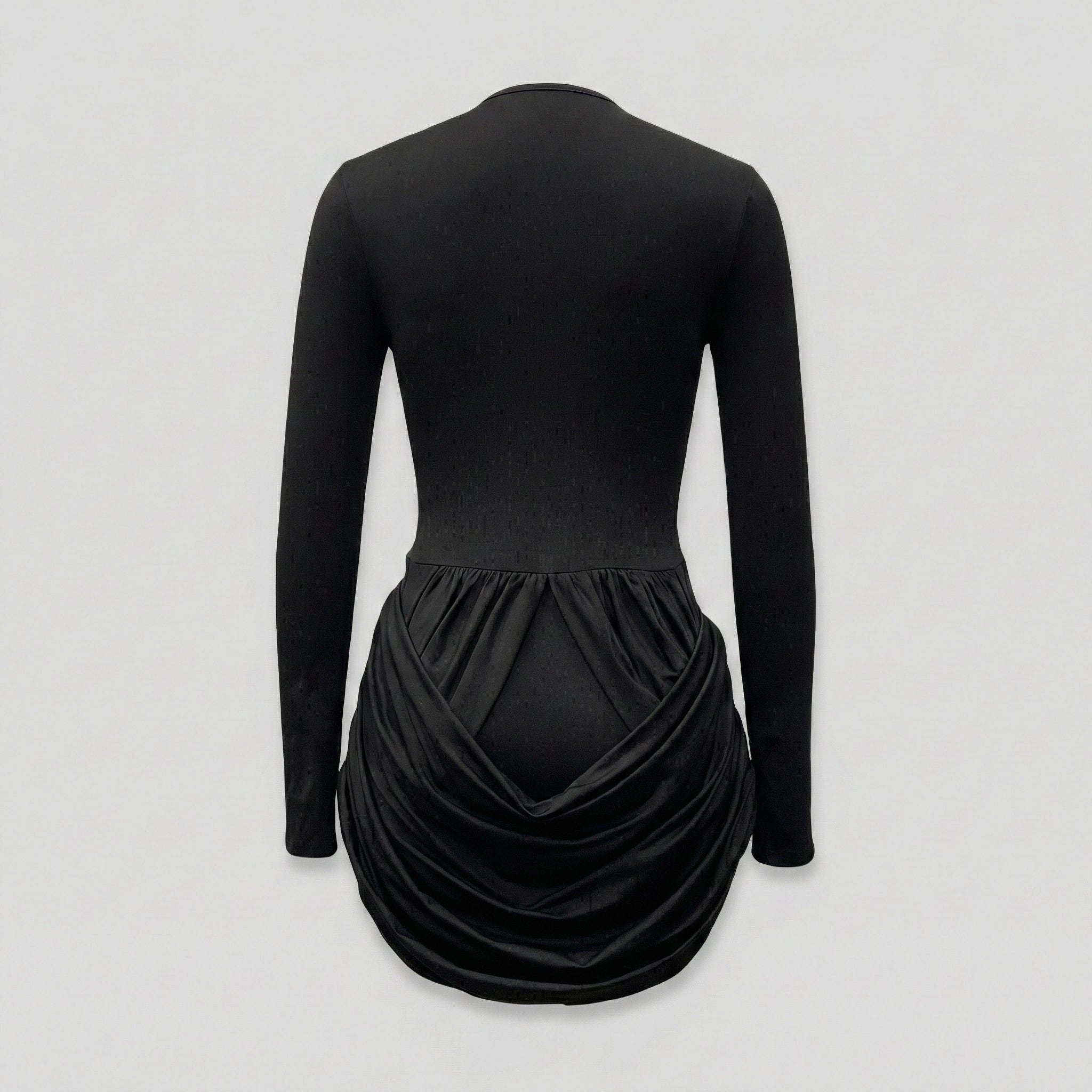 Black long-sleeve dress with a draped skirt on a light gray background