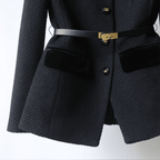 Black textured blazer with gold buttons and belt on a white background
