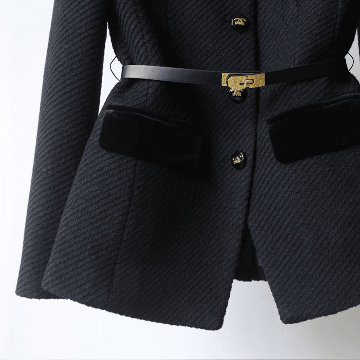 Black textured blazer with gold buttons and belt on a white background