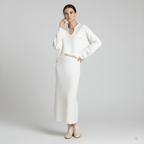 Woman wearing a white outfit on a plain background