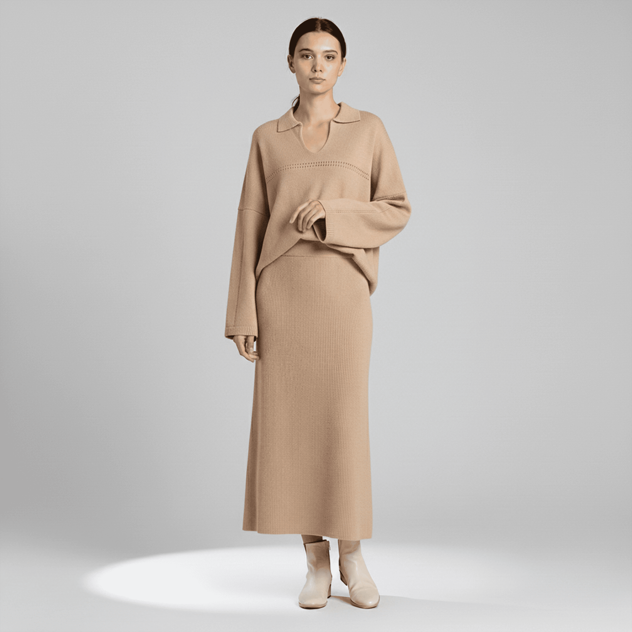 Woman wearing a beige outfit on a plain background